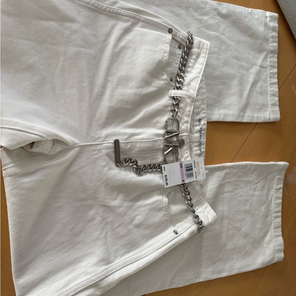 BNWT Michael Kors White wide legged Jean with rope belt.  Size 6